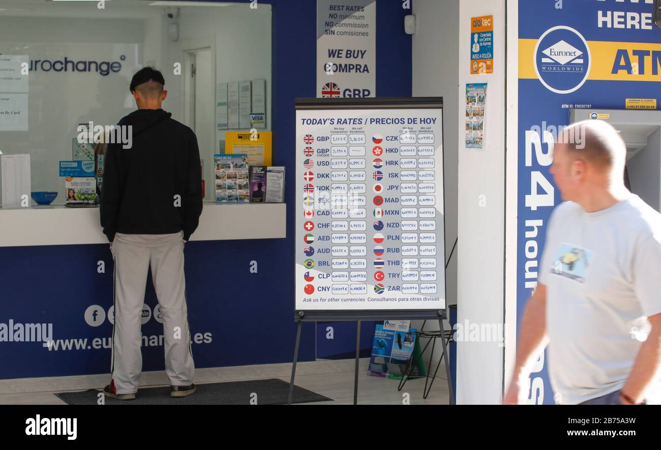 A man is standing at a money exchange office in Torremolinos, Spain on 13.02.2019. The possible brexite has considerable consequences for the Spanish economy.15 million British holidaymakers came to Spain last year and spent 14 billion euros. With a pound that depreciates sharply, they will spend less money, or seek targets in their own kingdom. The same applies to the 760,000 British citizens who have a second residence in Spain. [automated translation] Stock Photo