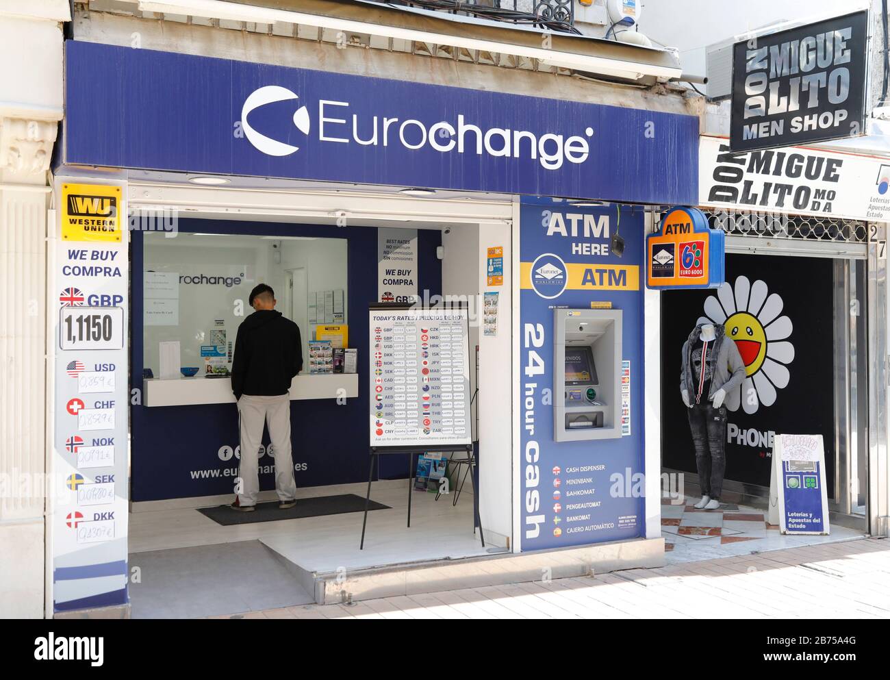 A man is standing at a money exchange office in Torremolinos, Spain on 13.02.2019. The possible brexite has considerable consequences for the Spanish economy.15 million British holidaymakers came to Spain last year and spent 14 billion euros. With a pound that depreciates sharply, they will spend less money, or seek targets in their own kingdom. The same applies to the 760,000 British citizens who have a second residence in Spain. [automated translation] Stock Photo