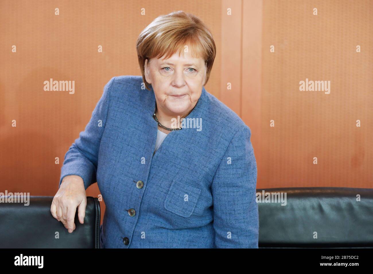 German Chancellor Angela Merkel takes her seat at the cabinet table with a serious expression before the start of a cabinet meeting. Merkel is resigning as CDU party leader, and she does not want to extend her chancellorship either. [automated translation] Stock Photo