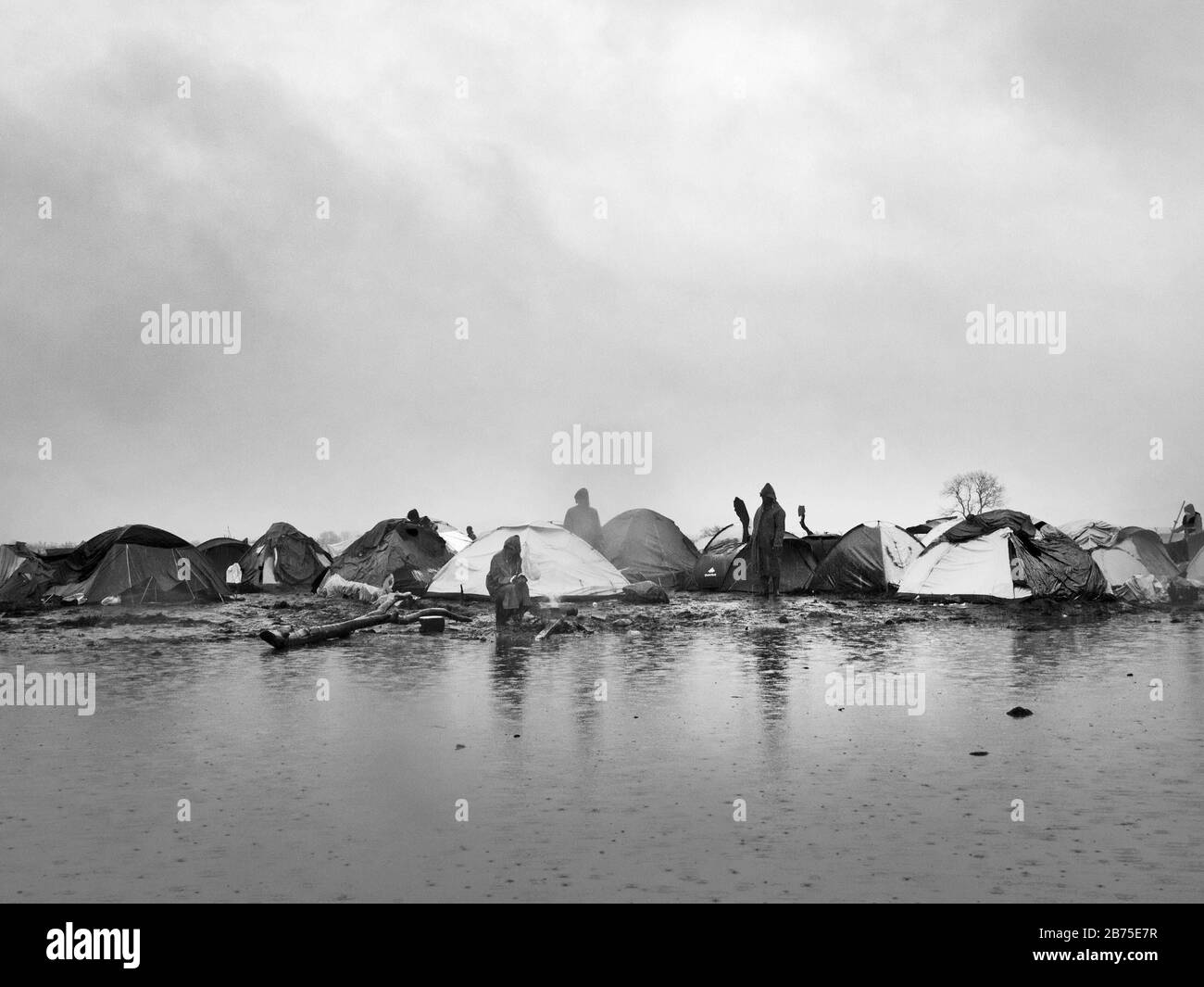 Refugee camp in Idomeni on the border with Macedonia. After days of rainfall, huge lakes have formed in the camp. [automated translation] Stock Photo