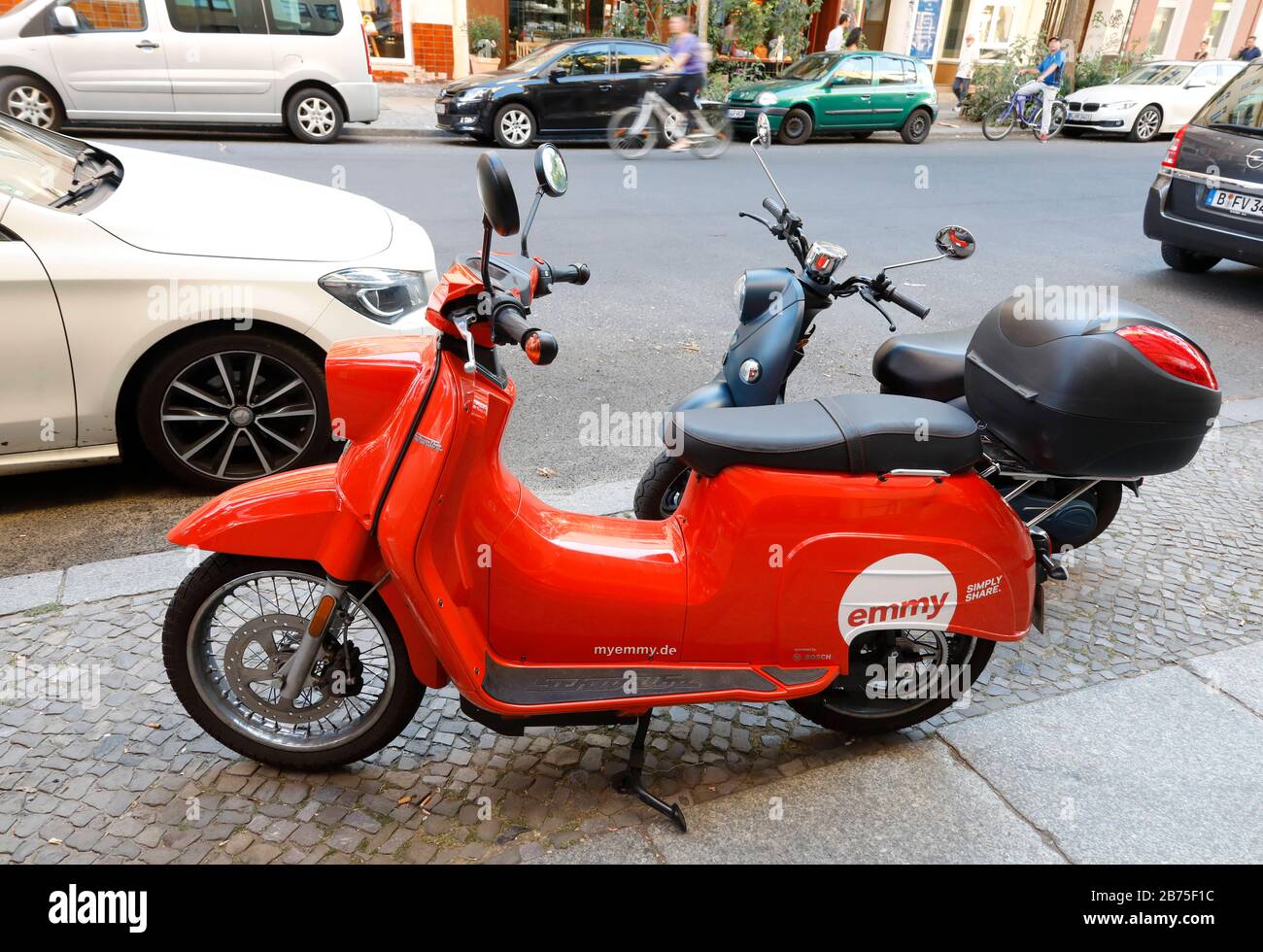 An emmy e-scooter in the design of the 'Schwalbe' and an 'unu' e-scooter on 06.08.2018 in Berlin. E-scooters from emmy can be rented in many German cities in a sharing procedure. [automated translation] Stock Photo