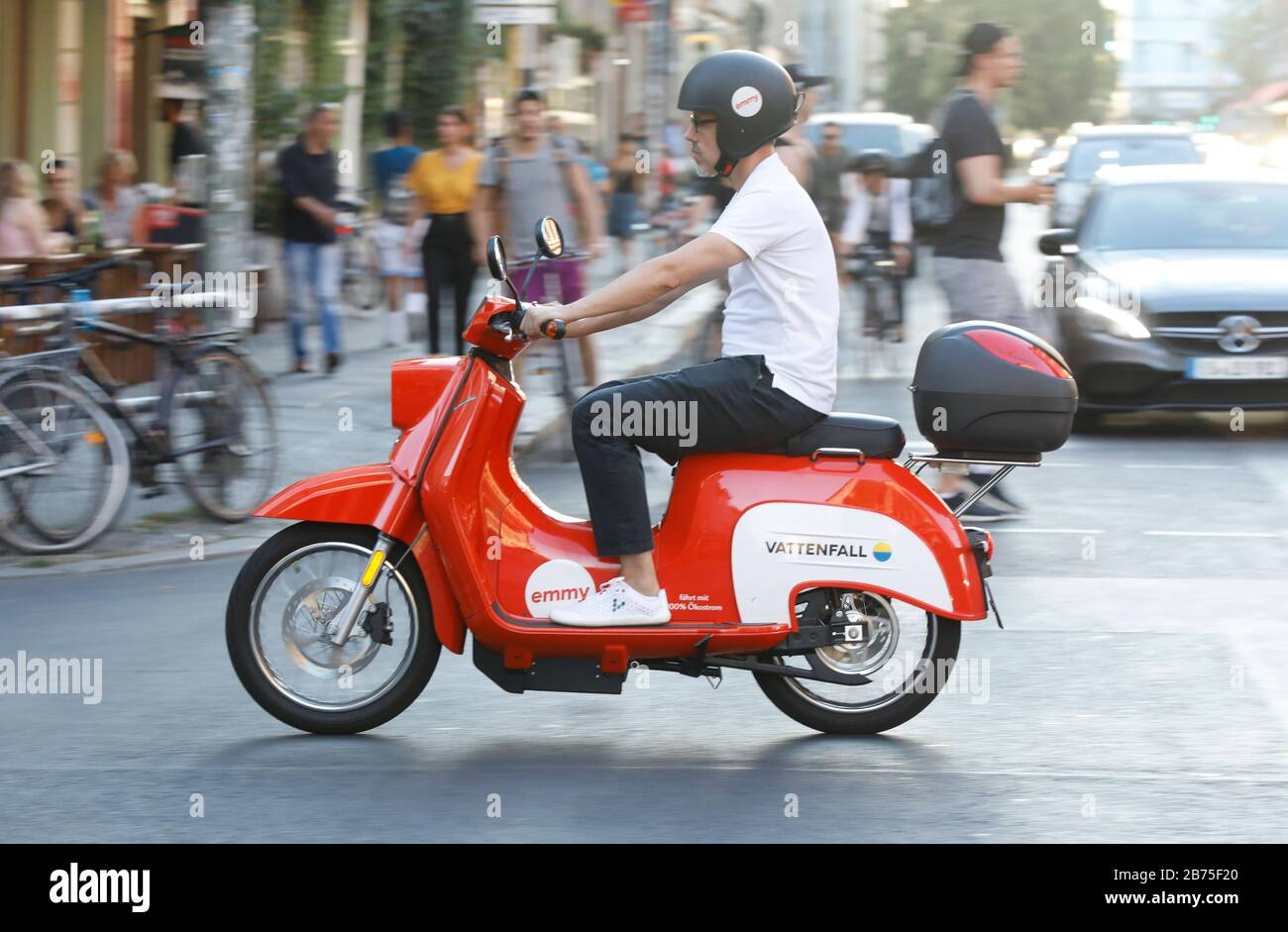With a rented e-scooter in the design of the 'Schwalbe' from the sharing provider emmy, a man is driving through Berlin Kreuzberg on 06.08.2018. [automated translation] Stock Photo
