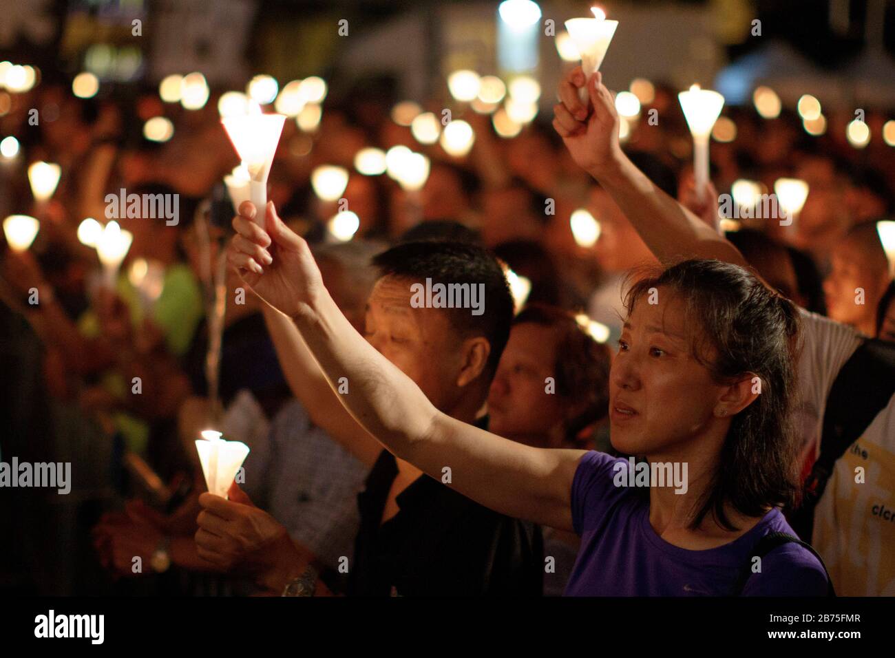 Thousands of people gather in Victoria Park to commemorate the 4 June 1989 massacre in Hong Kong, China, 04 June 2018. They also demand the end of the one-party rule in China and paid tribute to the deceased Chinese dissident and Nobel laureate Liu Xiaobo. Hong Kong is the only place on Chinese territory where such a vigil is allowed. Stock Photo