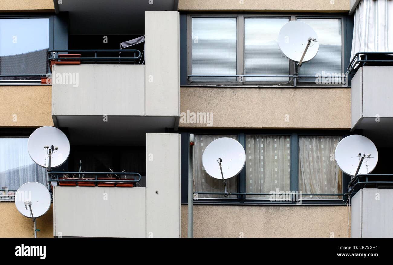 View of a residential house from the 70s, on some balconies are satellite dishes for TV reception attached, on 03.05.2018 [automated translation] Stock Photo