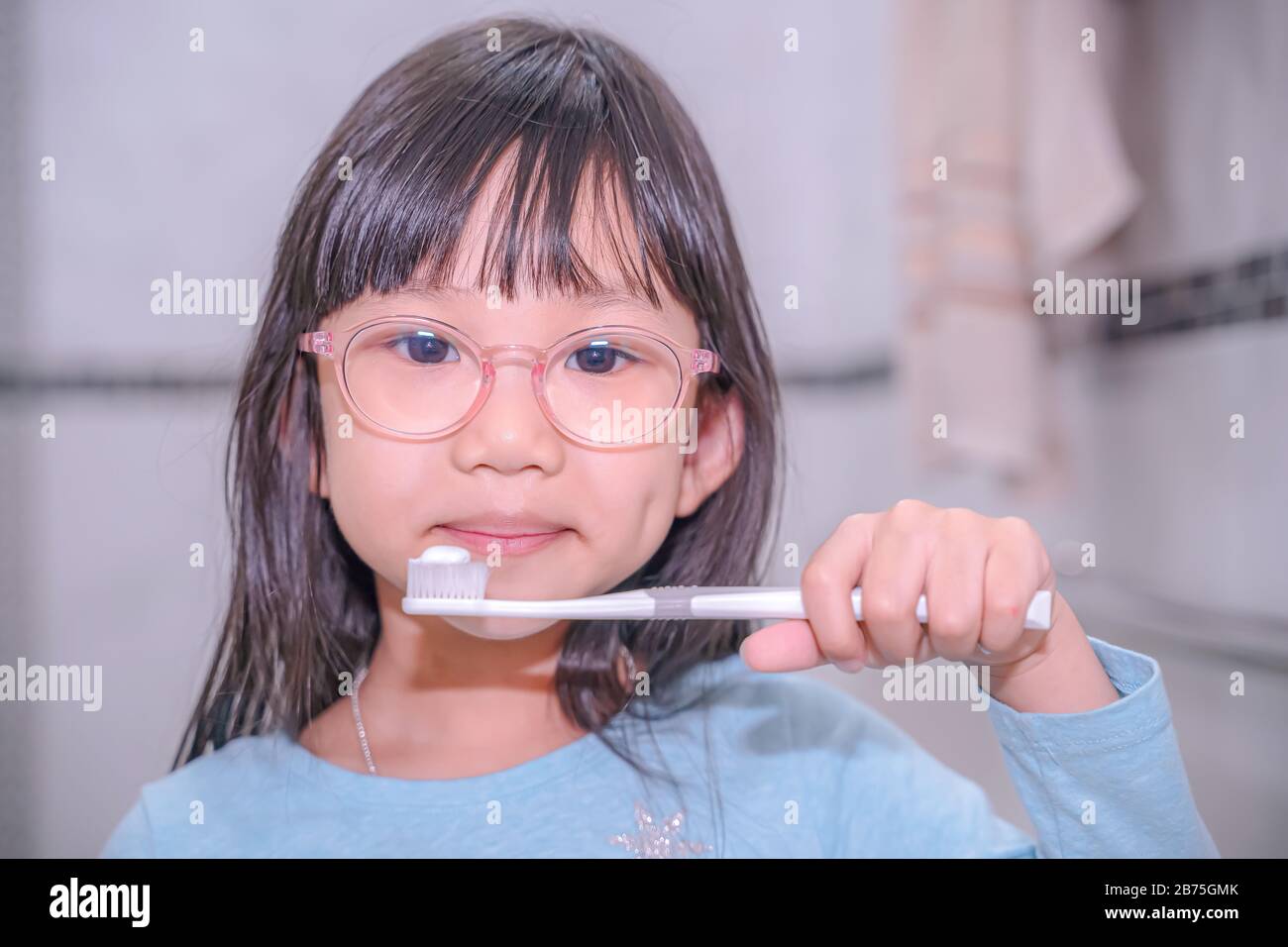 dental hygiene. happy little girl brushing her teeth.Little girl