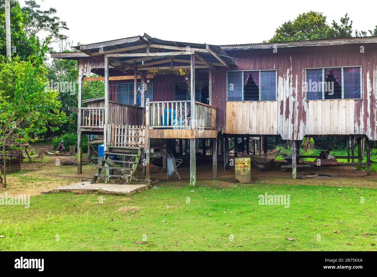 Traditional and common stilt house used by rain forest inhabitants in Borneo, Malaysia, Asia Stock Photo