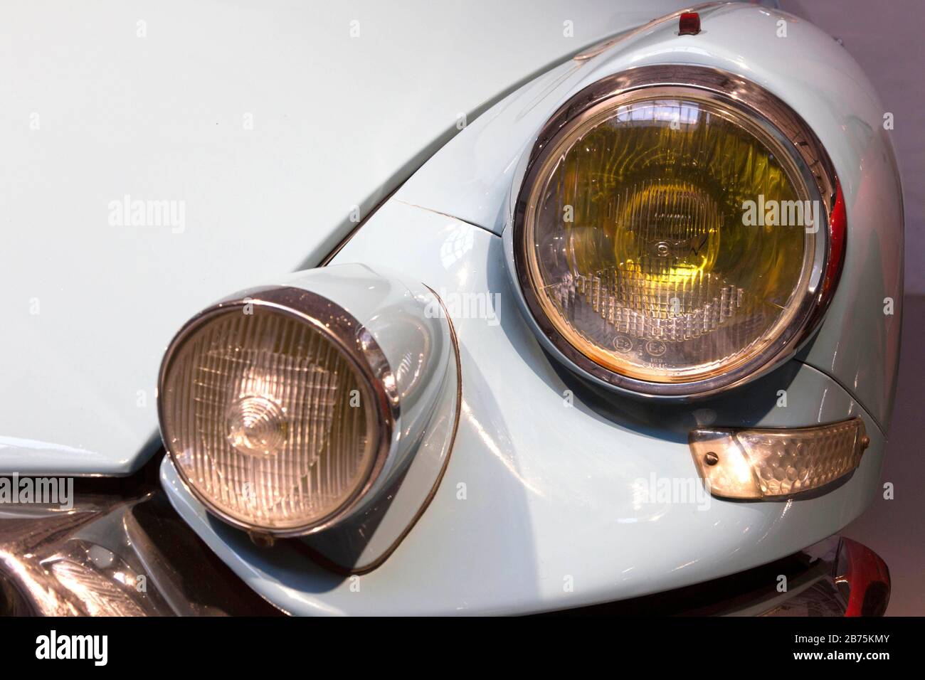 The front headlights of a Citroes DS 19 can be seen in the exhibition of the German Museum of Technology 'Umgeparkt - Autos aus dem Depot' on 05.12.2017 in Berlin. The German Museum of Technology has more than 200 historic old-timer cars. Only about 30 of them are permanently on display in the 'Mensch in Fahrt' exhibition, the other vehicles are in the museum depot. Due to reconstruction work in the depots, there is now the opportunity to briefly see 29 more vehicles from the collection in the Museum of Technology. [automated translation] Stock Photo