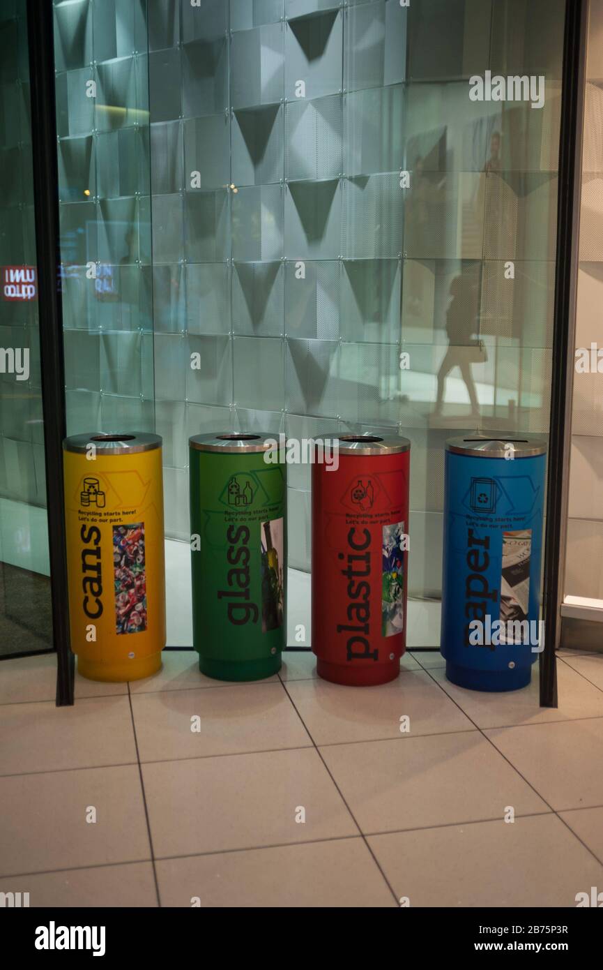 24.09.2017, Singapore, Republic of Singapore, Asia - Coloured waste bins with the indication for waste separation and recycling are located in a shopping centre. [automated translation] Stock Photo