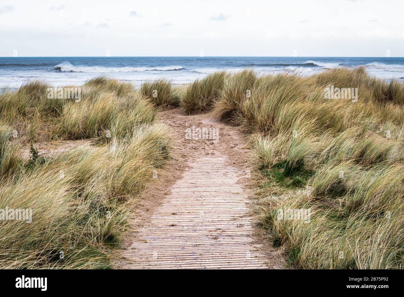 Wooden path that leads to Castlerock beach in Northern Ireland Stock Photo