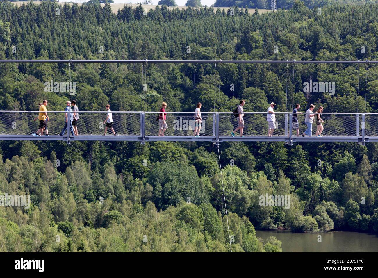 On 11.06.2017 visitors will walk over the rope suspension bridge at the Rappbode dam, 483 metres long, 100 metres above the valley floor. [automated translation] Stock Photo