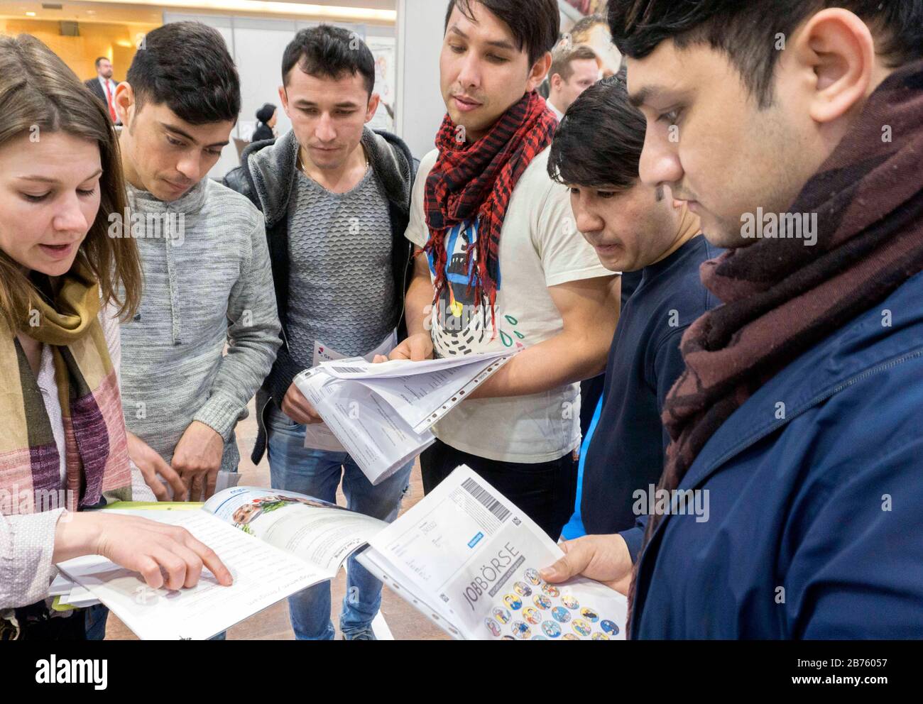 Afghan refugees will receive information about the Berlin job exchange for refugees from their teacher on 25.01.2017.4200 refugees looking for work have registered for the job exchange. [automated translation] Stock Photo