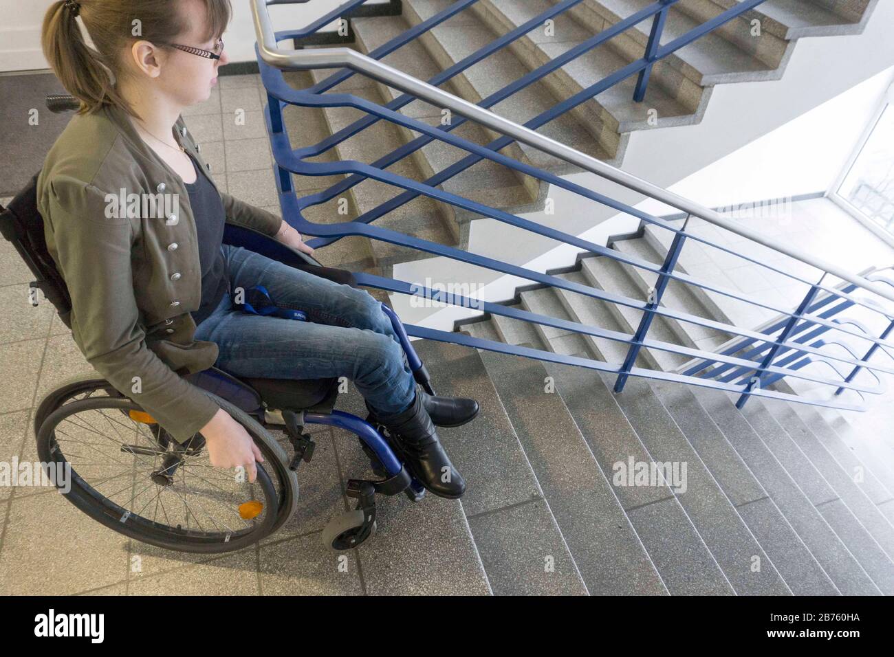 Woman in wheelchair on stairs hi-res stock photography and images - Alamy