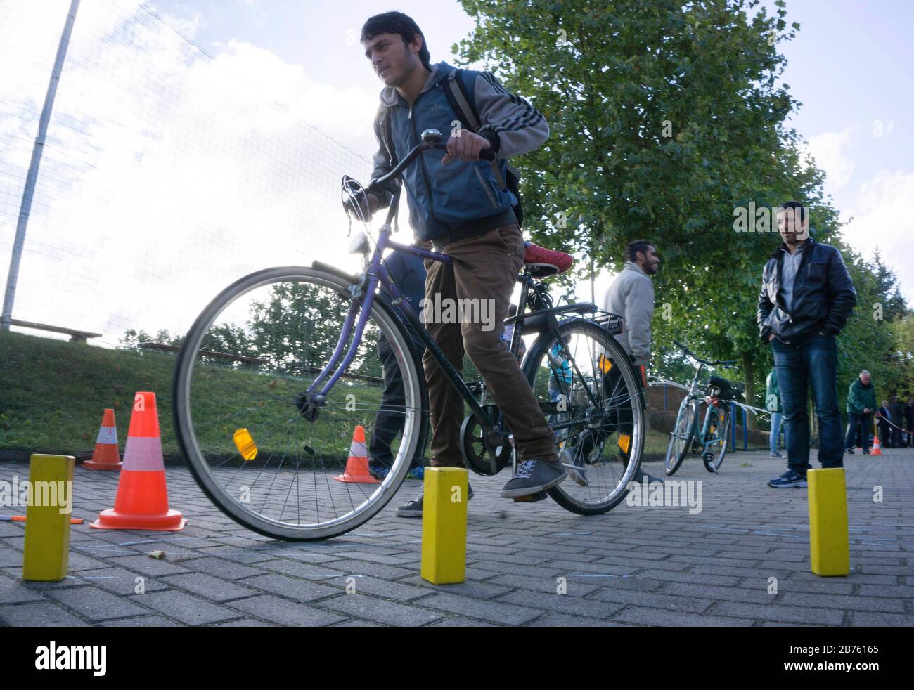 Syrian refugees will learn traffic rules and cycling during an integration course, on 05.10.2016. The Oberspreewald-Lausitz district and traffic guard will show and explain traffic signs and rules to the refugees in the rooms of the Grossraeschen sports club. [automated translation] Stock Photo