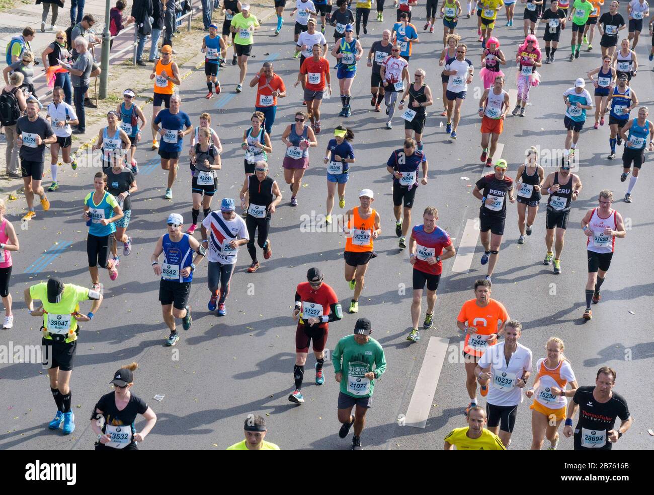 Runners of the 43rd Berlin Marathon will run along Berlin's Yorkstrasse. 41,283 runners participated in the marathon. [automated translation] Stock Photo