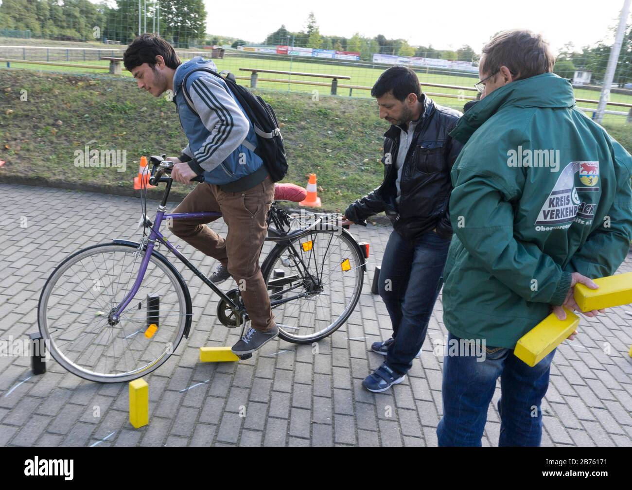 Syrian refugees will learn traffic rules and cycling during an integration course, on 05.10.2016. The Oberspreewald-Lausitz district and traffic guard will show and explain traffic signs and rules to the refugees in the rooms of the Grossraeschen sports club. [automated translation] Stock Photo