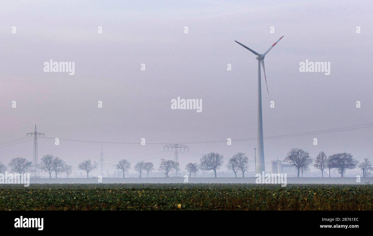 A windmill of a wind farm on a field in Nauen, on 23.11.2016, stands in the fog. [automated translation] Stock Photo