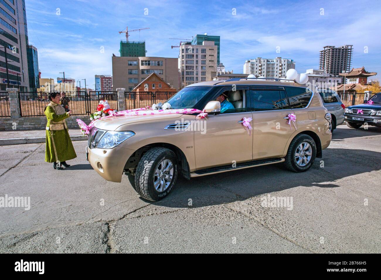 Mongolia, Ulan Bator, 15.10.2015. Decorated Japanese SUV car (Nissan Gold) in front of the wedding palace in Ulan Bator, Mongolia on 15.10.2015. [automated translation] Stock Photo