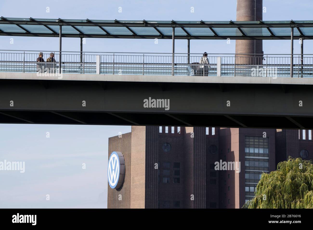 On 26.10.2015, visitors will cross a bridge into the Autostadt, the city of Wolfsburg is reacting to the expanding exhaust gas crisis at Volkswagen. The city decreed a budget freeze and a hiring freeze. Volkswagen is the largest employer in the city. [automated translation] Stock Photo