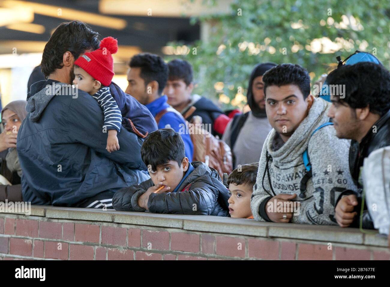Refugees arrived at Schoenefeld station on 01.10.2015 by a special train. They will then be taken by bus to accommodation in Berlin. [automated translation] Stock Photo