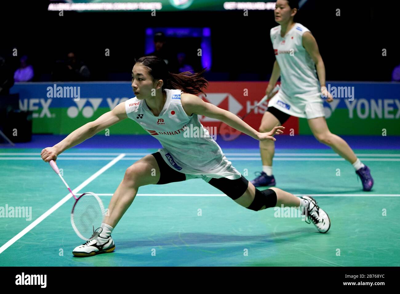 Japans Misaki Matsutomo (left) and Ayaka Takahashi in action in the Womens doubles match during the YONEX All England Open Badminton Championships at Arena Birmingham Stock Photo