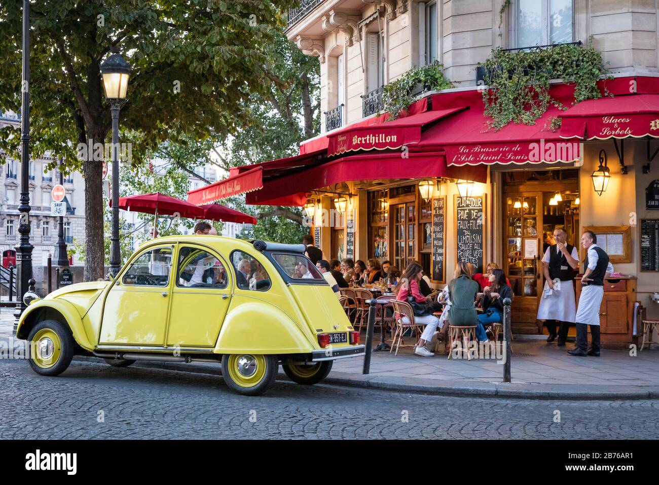 Classic Citroen - le Deux Chevaux parked at Cafe Saint Louis on Ile Saint Louis, Paris, France Stock Photo