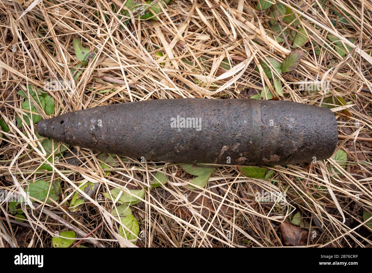 UXO unexploded ordnance - Unexploded bullet from World War II found in the forests of the Eastern Carpathians in Poland, Europe. Stock Photo