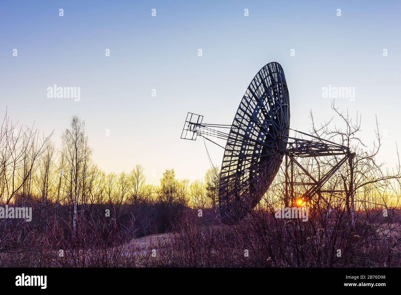 radio telescope dish satellite equipment at sunset landscape Stock Photo