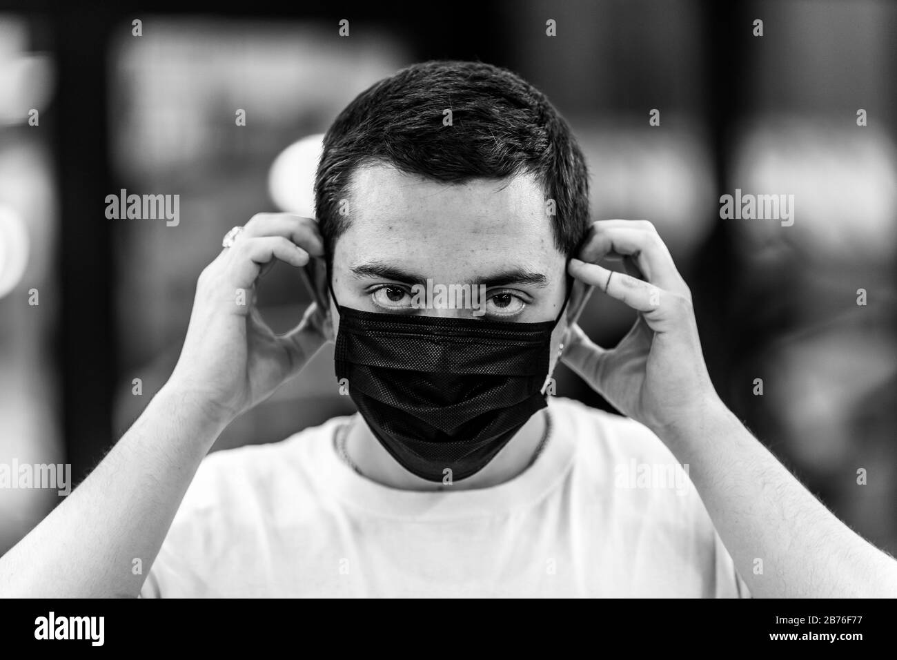 Person wearing a mask air pollution Black and White Stock Photos ...