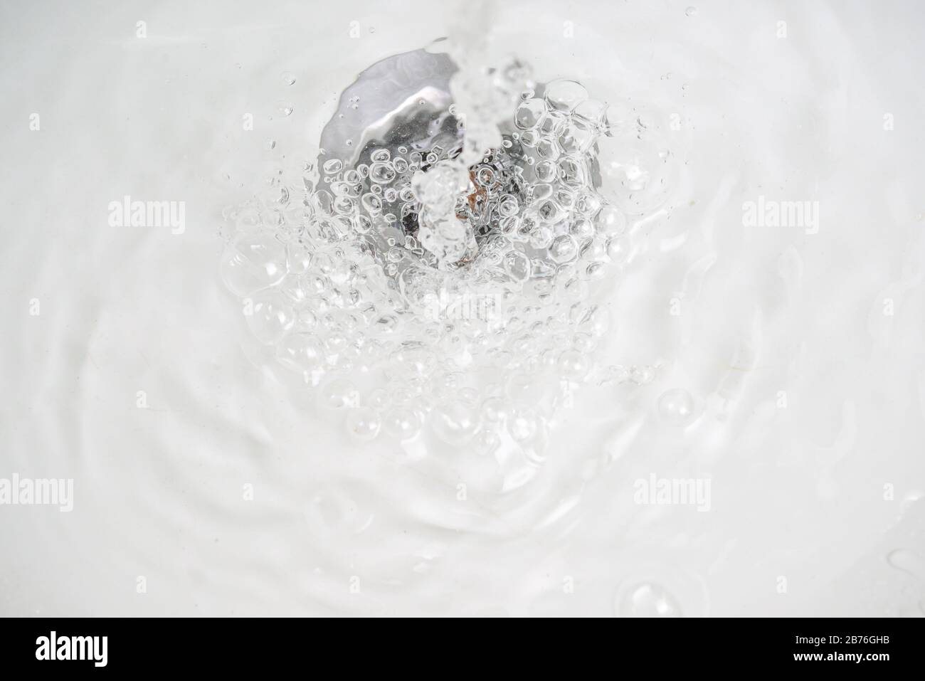 water flow in sink with bubbles Stock Photo Alamy