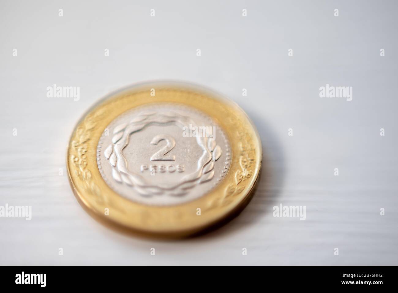 Macrophotography of two Argentine pesos coin on a white background Stock Photo