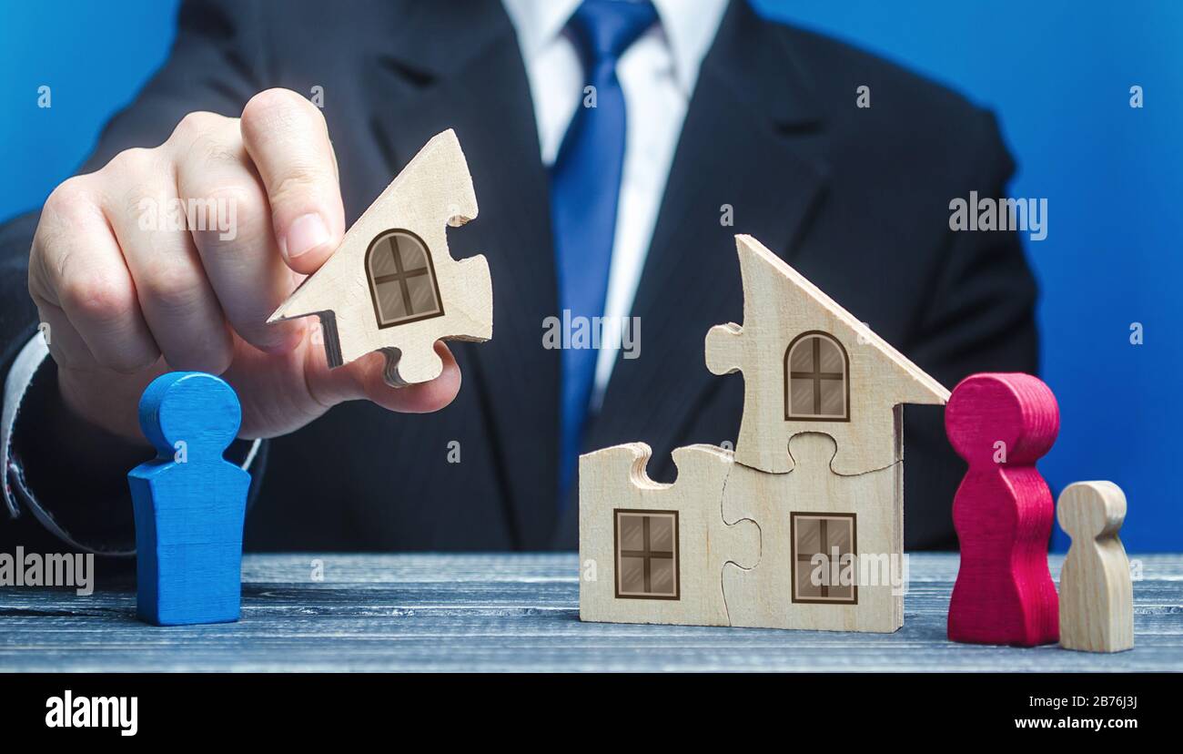 A man gives husband part of house after a divorce. Division of jointly acquired property, conclusion of a marriage contract. Dispute between spouses. Stock Photo