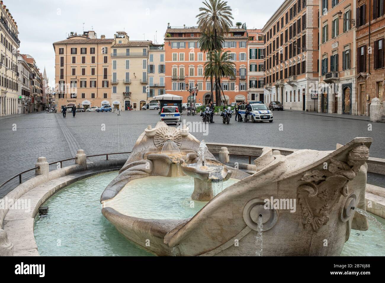 Piazza di Spagna, in Rome, deserted and patrolled by the police for the Coronavirus epidemic that hit Italy. The Italian government, with a series of decrees, has limited the possibility of movement of people to prevent further infections to the bare minimum. Stock Photo