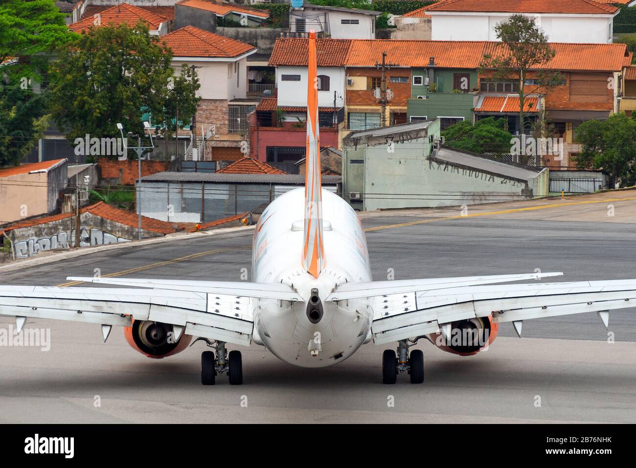 Brazilian airline GOL operating its Boeing 737 in Congonhas Airport, know as the concrete jungle by its central location in Sao Paulo, Brazil. Stock Photo