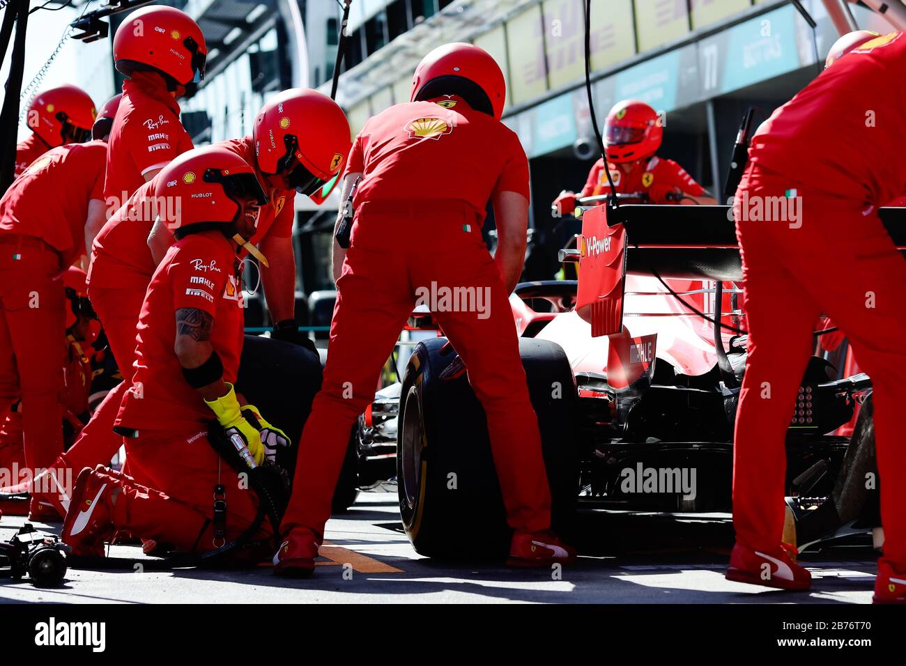 Team Ferrari rehearse a pit lane tyre change ahead of the Australian Formula One Grand Prix Stock Photo