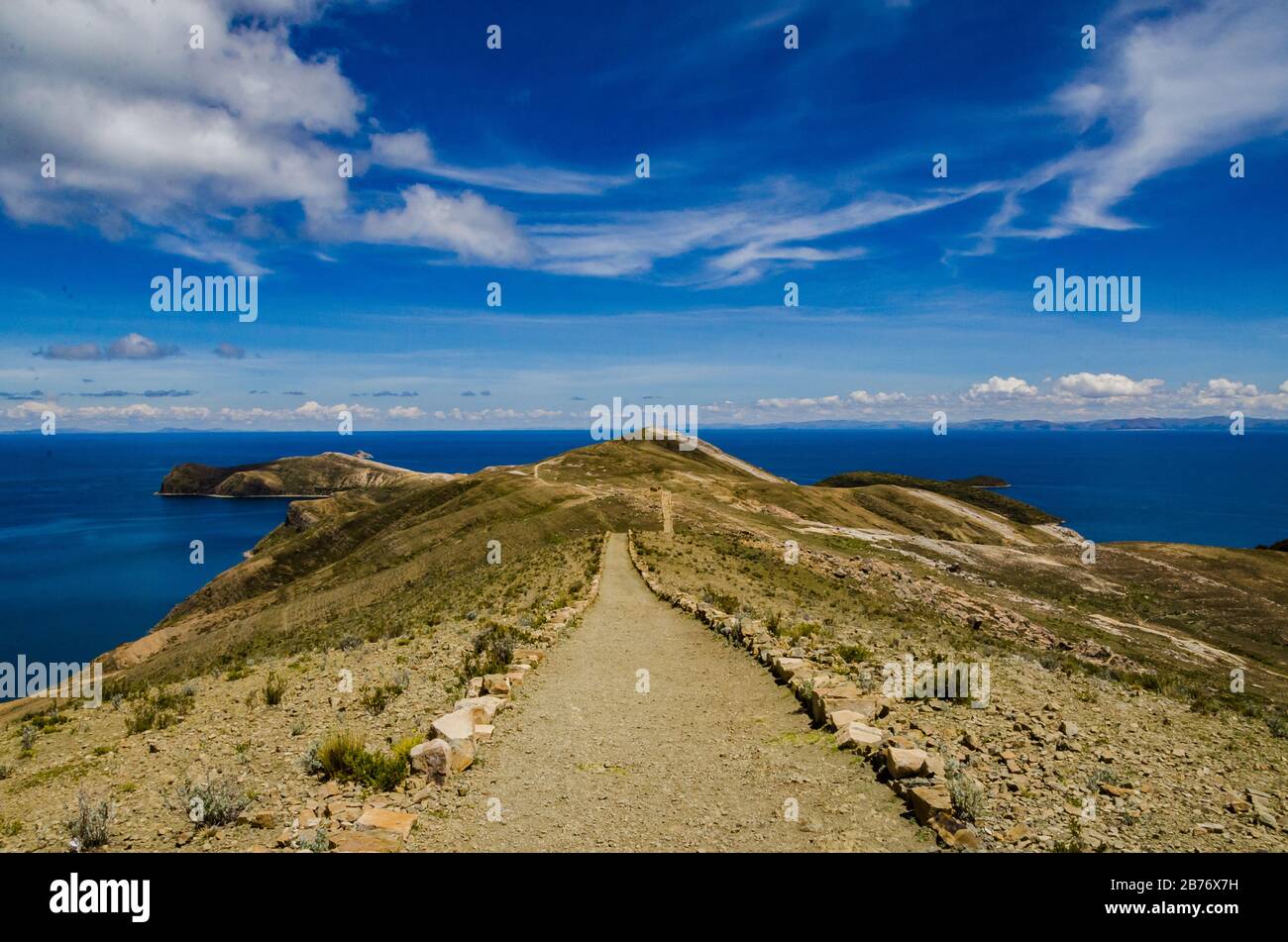 Landscape on Isla del Sol with a blue sky Titikaka Lake and a road Stock Photo
