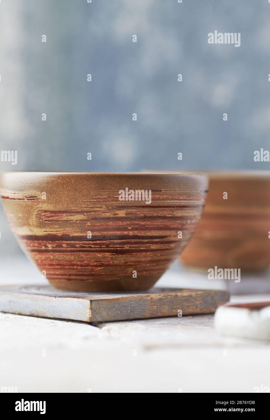 Traditional ceramic bowls on bright background Stock Photo - Alamy