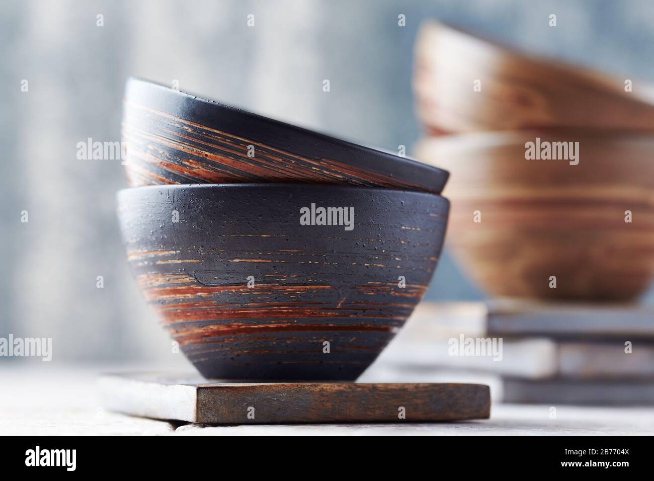 Traditional ceramic bowls on bright background Stock Photo - Alamy