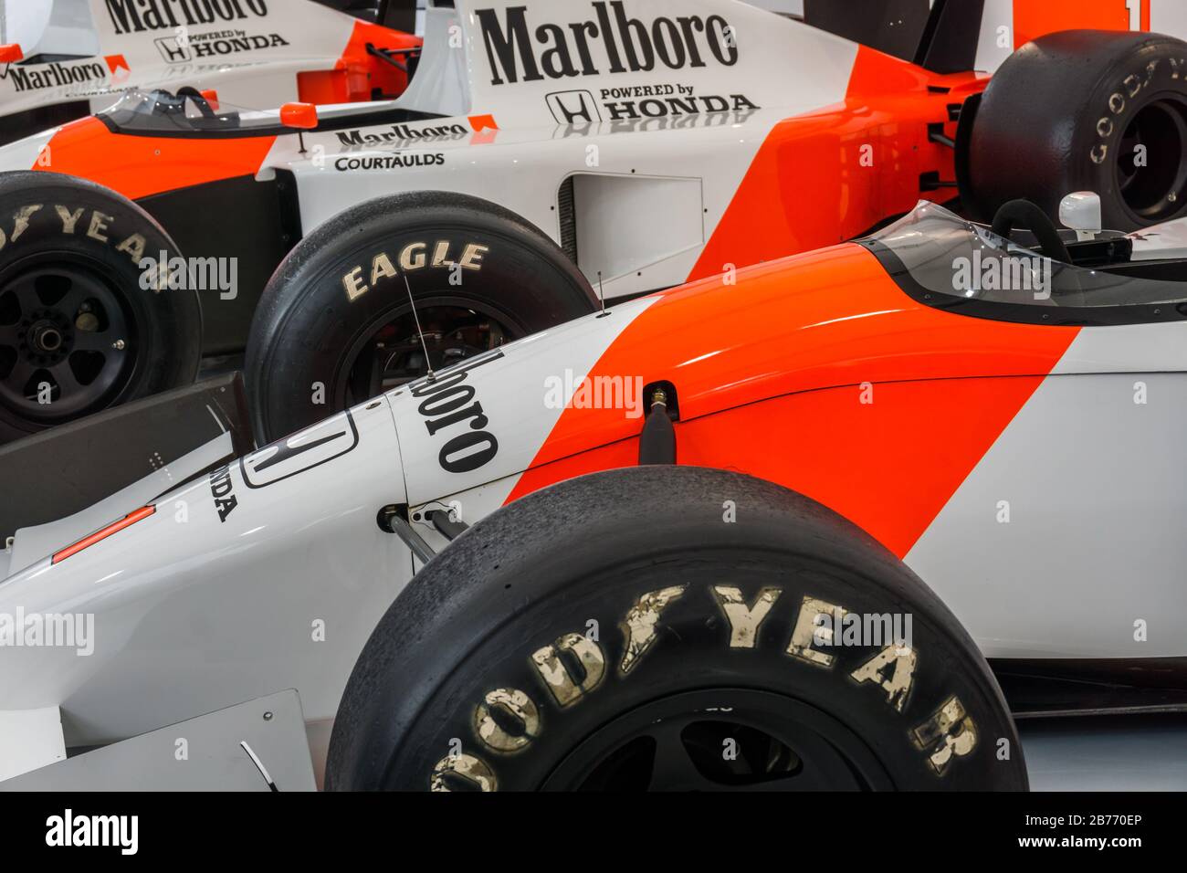 Close up detail of a McLaren Honda MP4/7 in the Honda Collection Hall in Suzuka, Japan, with an MP4-5 in the background. Stock Photo