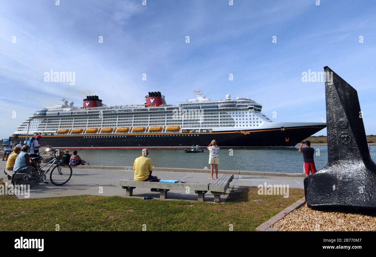 Port Canaveral, United States. 13th Mar, 2020. People watch as the Disney Dream cruise ship departs from Port Canaveral in Florida the day before the cruise line suspends its operations for all new departures effective March 14 in response to the coronavirus (COVID-19) outbreak. Credit: SOPA Images Limited/Alamy Live News Stock Photo