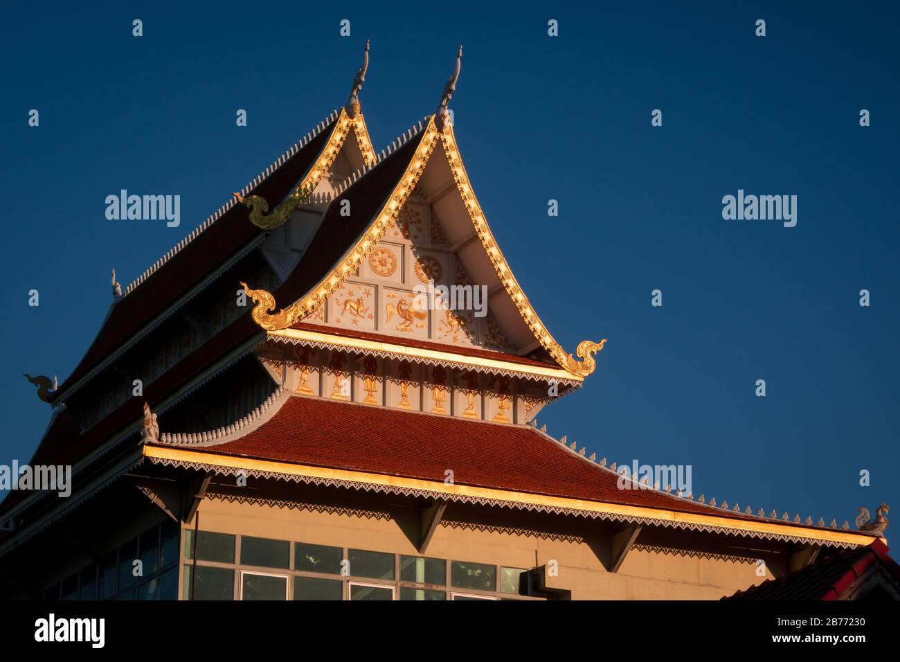 Golden rooftop of buddhist temple in Chiang Mai, Thailand. Royalty free stock photo. Stock Photo