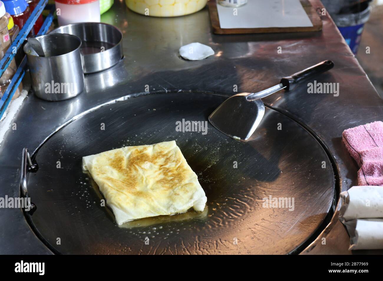 Roti eggs fried (thai word) in a night market street, Indian food ...