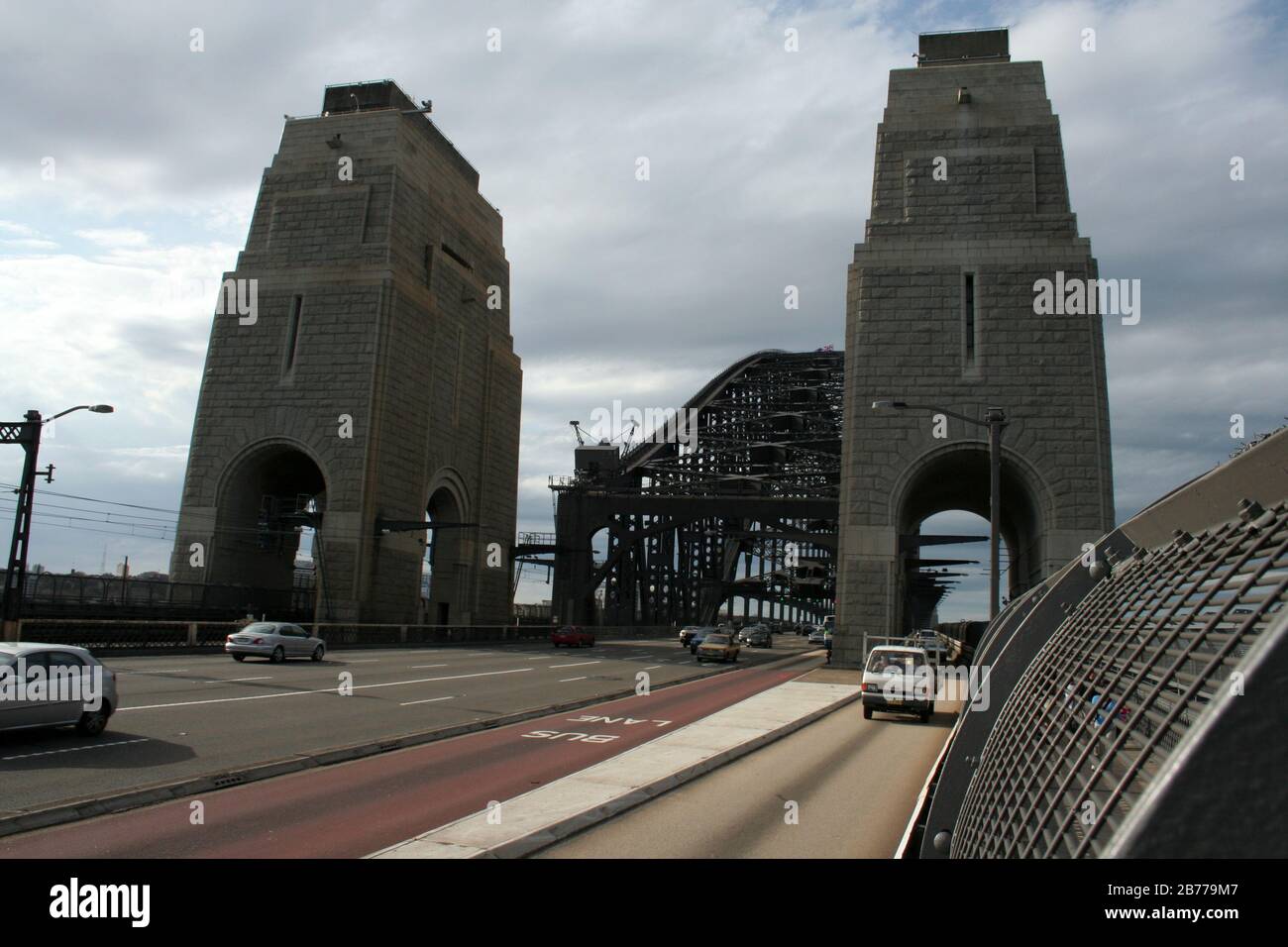 VIEW NORTH OF THE SYDNEY HABOUR BRIDGE WITH PYLONS IN THE FOREGROUND. NSW, AUSTRALIA. Stock Photo