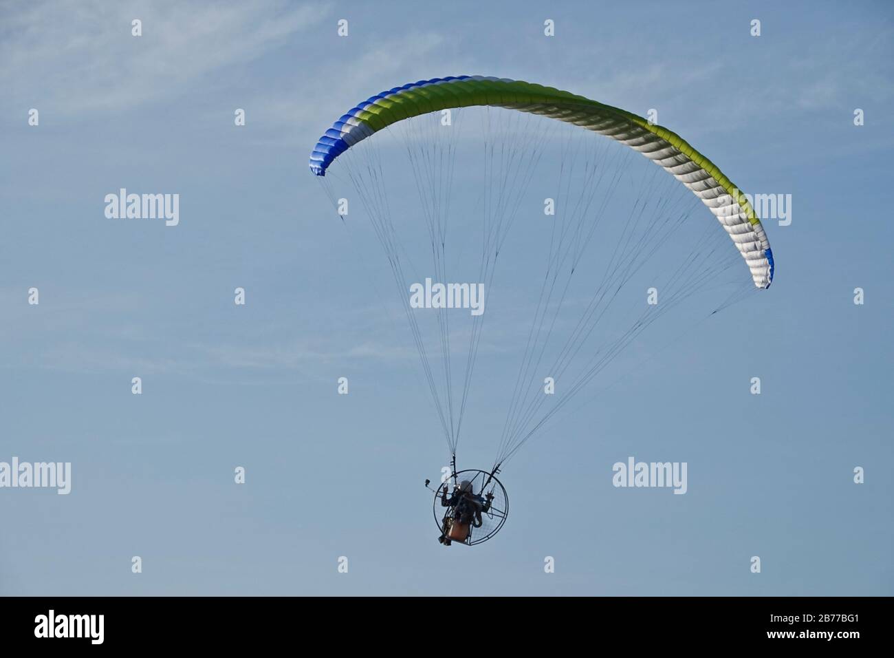 A hot air balloon festival features paragliders, hot air balloons and other forms of air transports. Stock Photo