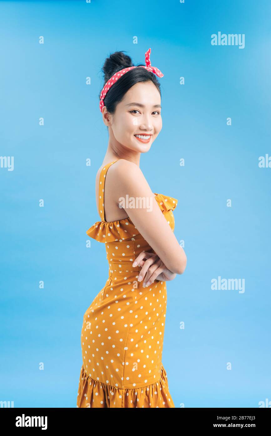 Beautiful Chinese woman posing in a white shirt and a pair of black panties  and bra isolated on a white background Stock Photo - Alamy