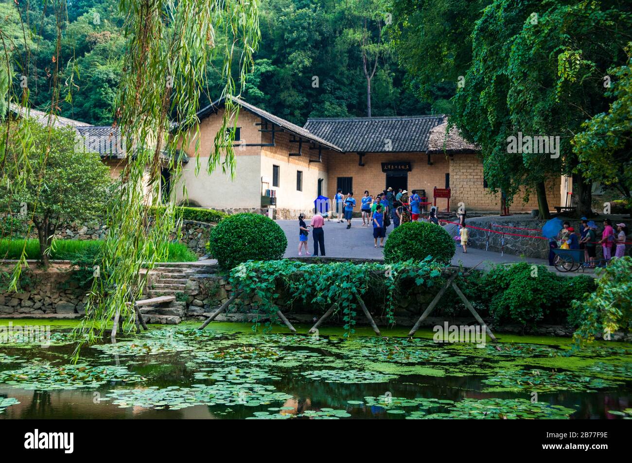 Chinese tourists on the red tourism trail at the childhood home of Mao Zedong in the village of Shaoshan near the city of Changsha. Stock Photo