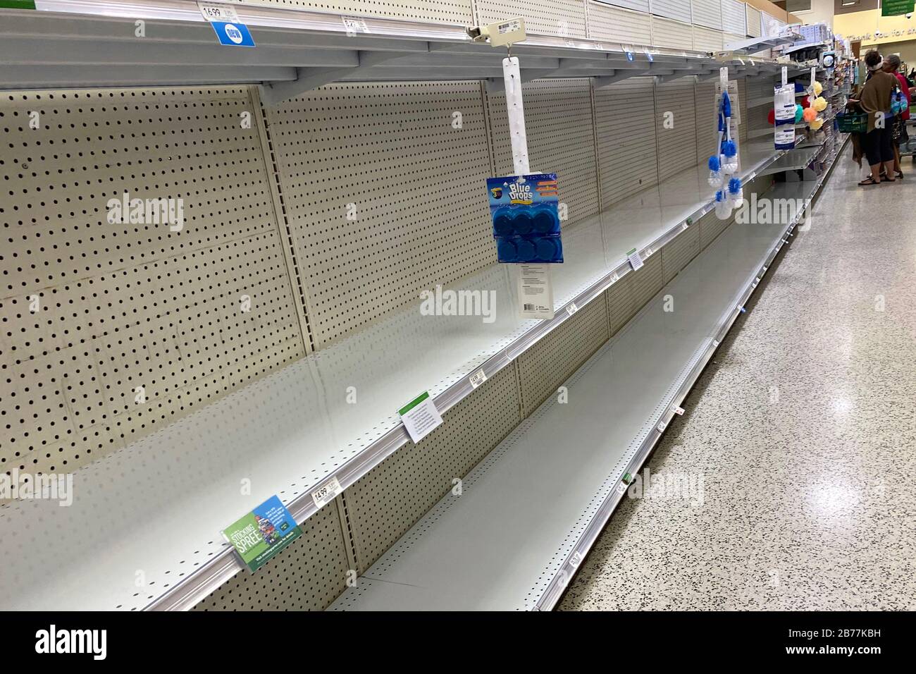 General overall of rationing sign of empty shelves at Publix
