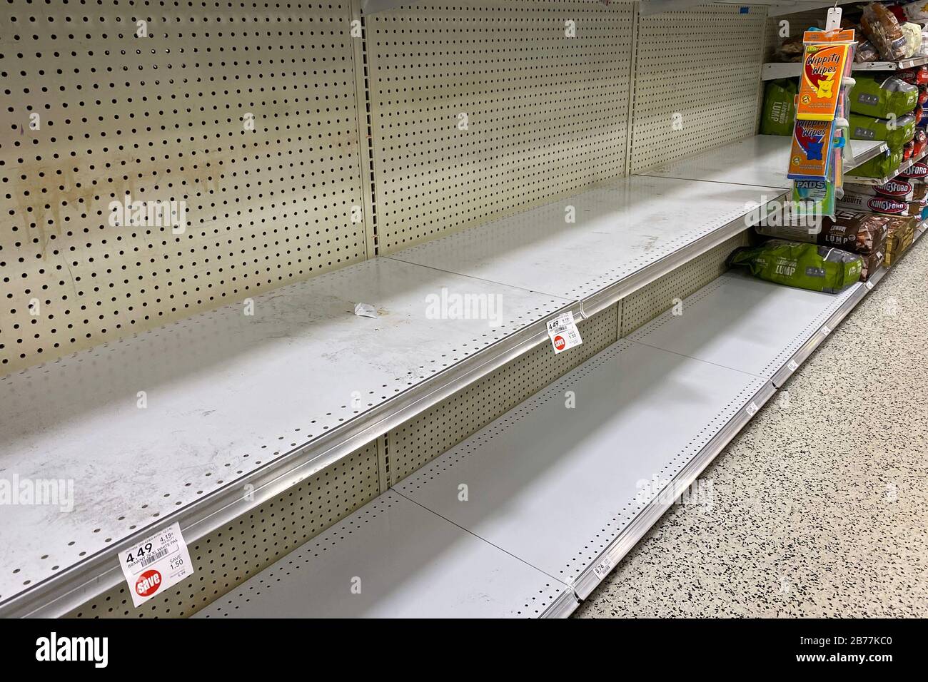 General overall of rationing sign of empty shelves at Publix