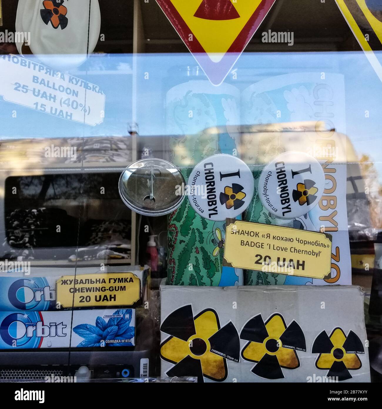 Radioactivity themed souvenirs behind glass at the border of the Chernobyl exclusion zone in Ukraine. Stock Photo