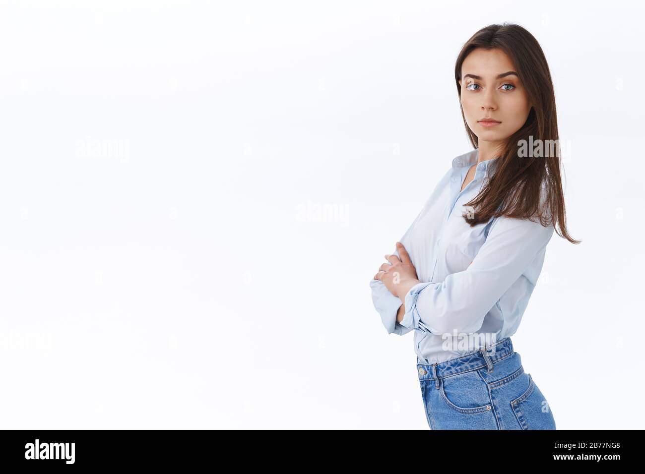 Confident stylish professional woman running own business looking assertive and ready, standing in profile turn face to came with sassy determined Stock Photo