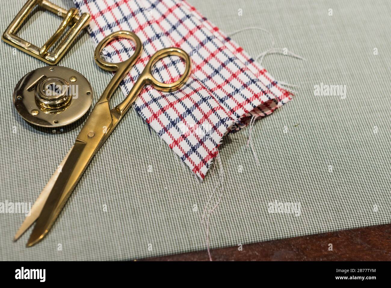 Luggage Maker's' Table - Malletier - With Gold Implements and Checkered Cloth Stock Photo